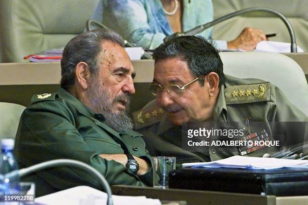 Cuban President Fidel Castro and his brother, Armed Forces Minister Raul Castro , confer during the plenary session of the National Assembly 03...