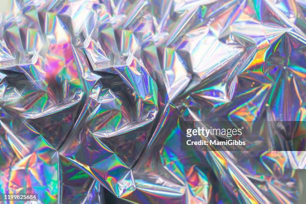 light is reflected on the hologram color paper - rainbow light reflection stock pictures, royalty-free photos & images