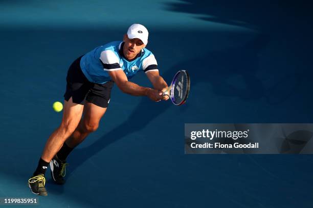 John Millman of Australia plays a backhand shot against Benoit Paire of France during day four of the 2020 ASB Classic at ASB Tennis Centre on...