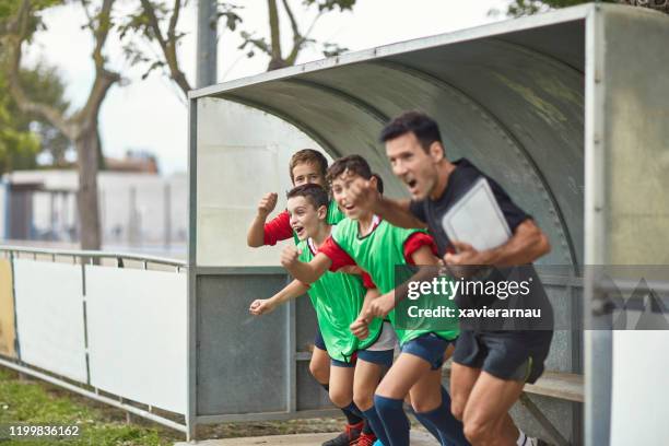 young spanish footballers and coach cheering triumph - coach yelling stock pictures, royalty-free photos & images