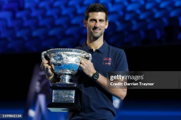 Last years Australian Open Winner Novak Djokovic of Serbia poses with the trophy during the official draw ahead of the 2020 Australian Open at...