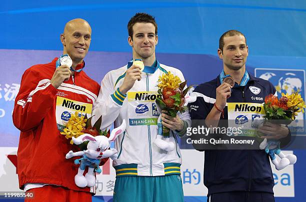 Gold medalist James Magnussen of Australia poses with silver medalist Brent Hayden of Canada and bronze medalist William Meynard of France after the...