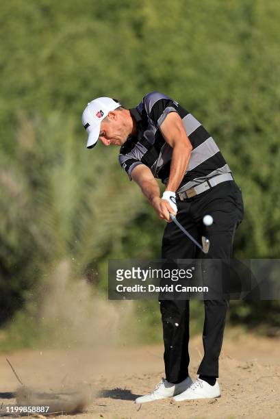 Benjamin Hebert of France plays his second shot on the 14th hole during the first round of the Abu Dhabi HSBC Championship at Abu Dhabi Golf Club on...