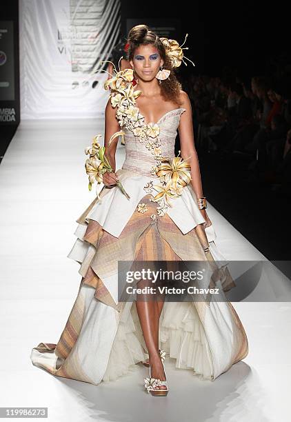 Model walks the runway during the Fundacion Universitaria Del Area Andina show on day two of Colombiamoda 2011 at Plaza Mayor on July 26, 2011 in...