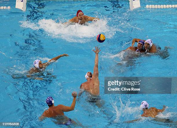 Peter Biros of Hungary stretches for the ball in the Men's Water Polo semi final match between Hungary and Serbia during Day Thirteen of the 14th...