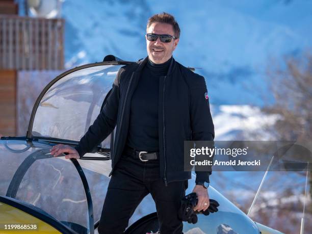 Jose Garcia poses after a flight at the alpine altiport during the third day of the 23rd L'Alpe D'Huez International Comedy Film festival on January...