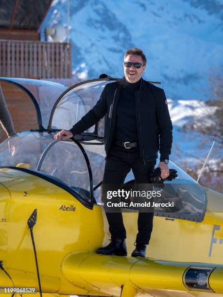 Jose Garcia poses after a flight at the alpine altiport during the third day of the 23rd L'Alpe D'Huez International Comedy Film festival on January...