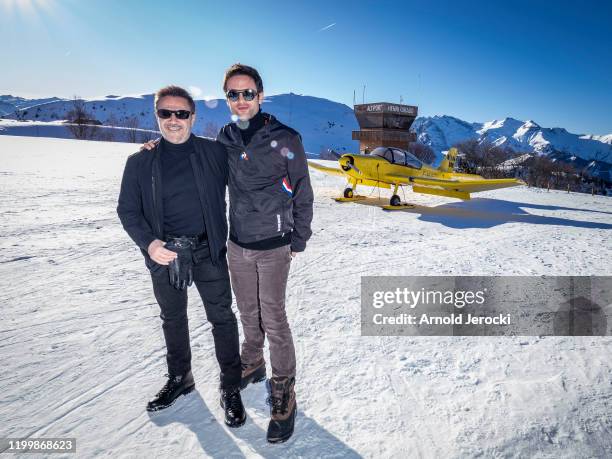 Jose Garcia and Julien Gauger poses after a flight at the alpine altiport during the third day of the 23rd L'Alpe D'Huez International Comedy Film...