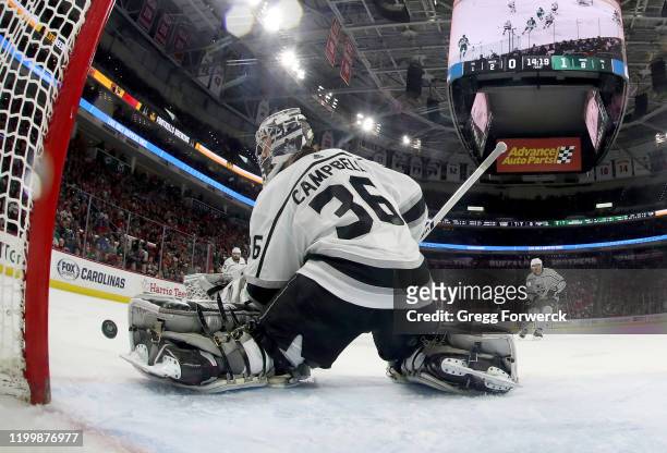 Drew Doughty of the Los Angeles Kings goes down in the crease to make a glove save during an NHL game against the Carolina Hurricanes on January 11,...