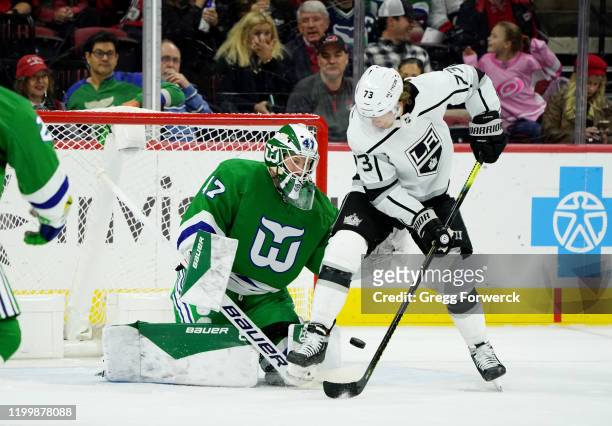 James Reimer of the Carolina Hurricanes makes a pad save as Tyler Toffoli of the Los Angeles Kings creates traffic during an NHL game on January 11,...