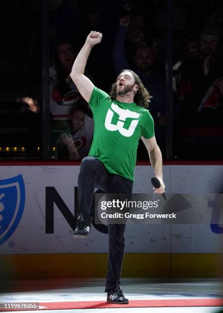 Adam Lee Decker sings the national anthem prior to an NHL game between the Carolina Hurricanes and the Los Angeles Kings on January 11, 2020 at PNC...