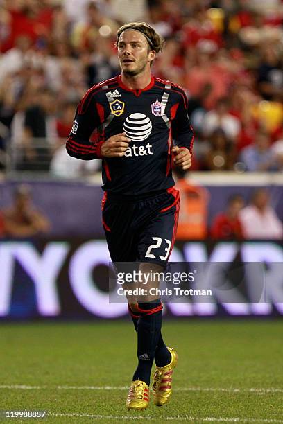 David Beckham of the MLS All-Stars runs against the Manchester United during the MLS All-Star Game at Red Bull Arena on July 27, 2011 in Harrison,...