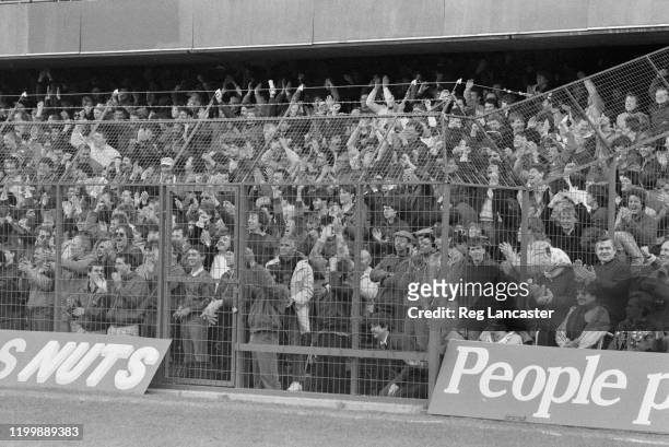 Supporters behind newly-installed electric fences at Chelsea's Stamford Bridge ground during a Cannon League Division 1 match against Tottenham...