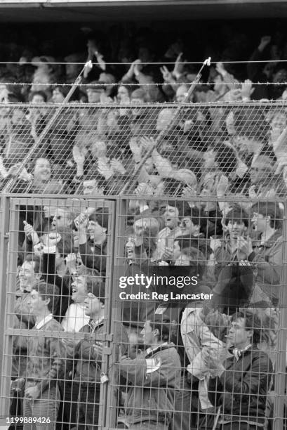 Supporters behind newly-installed electric fences at Chelsea's Stamford Bridge ground during a Cannon League Division 1 match against Tottenham...