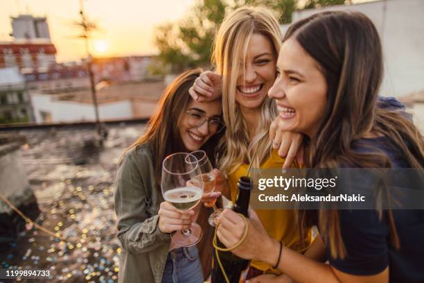 celebration time - champagne rooftop stock pictures, royalty-free photos & images