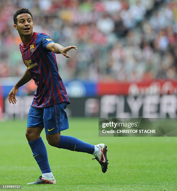 Barcelona's midfielder Thiago Alcantara gestures during their Audi Cup football match FC Barcelona vs SC International de Porto Alegre in Munich,...