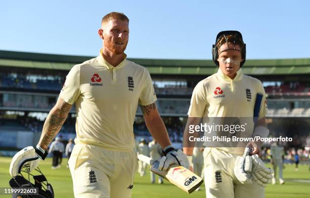 Ben Stokes and Ollie Pope of England leave the field after Day One of the Third Test between England and South Africa on January 16, 2020 in Port...