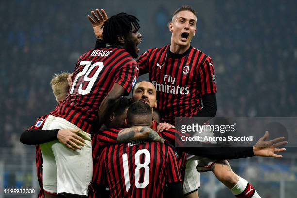 Zlatan Ibrahimovic of AC Milan celebrates with team mates after scoring the goal of 0-2 during the football match between FC Internazionale and AC...