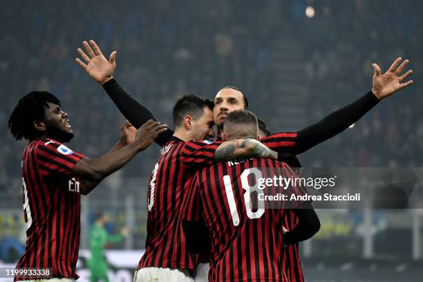 Zlatan Ibrahimovic of AC Milan celebrates with team mates after scoring the goal of 0-2 during the football match between FC Internazionale and AC...