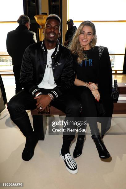Paul Pogba and his wife Maria Salaues attend the Amiri Menswear Fall/Winter 2020-2021 show as part of Paris Fashion Week on January 16, 2020 in...