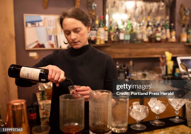 Bartender Marie Bradford mixes up cocktails for guests at Vessel and Vine on Saturday, Jan. 11, 2020.