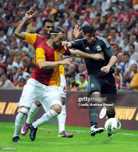 Emiliano Insua of Liverpool battles for the ball during a pre-season friendly match between Galatasaray and Liverpool at Turk Telekom Arena on July...