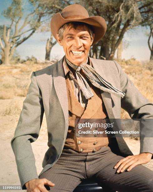 American actor James Coburn in a promotional portrait for William A. Graham's comedy western 'Waterhole No. 3', 1967.