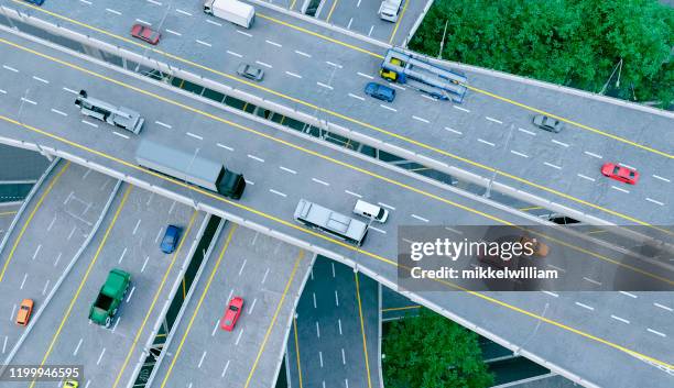 mobility on the roads with cars and trucks seen from drone point of view - tesla truck stock pictures, royalty-free photos & images