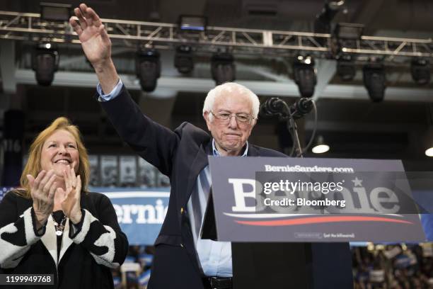 Senator Bernie Sanders, an Independent from Vermont and 2020 presidential candidate, right, raises his hand as his wife Jane O'Meara Sanders claps...