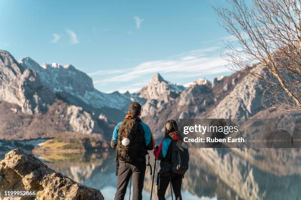 pilgrims on the way to santiago looking at the mountains landscape - camino de santiago stock pictures, royalty-free photos & images