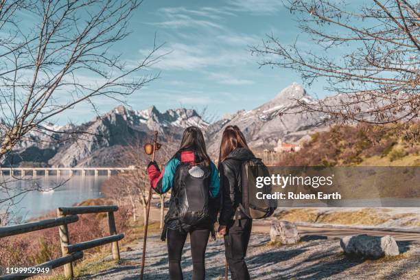 two females pilgrims looking at the landscape - camino de santiago stock-fotos und bilder