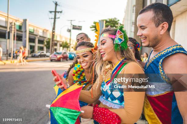 group of dancers waiting for taxi - recife carnival stock pictures, royalty-free photos & images