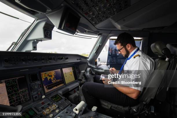 Pilot Using Computer 44 Pilot Cockpit Tablet Stock Photos, High-Res Pictures, and Images ...