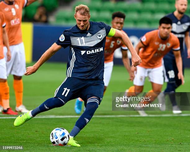 Melbourne Victory's Ola Toivonen scores from the spot against Chiangrai United during their AFC Champions League football match in Melbourne on...