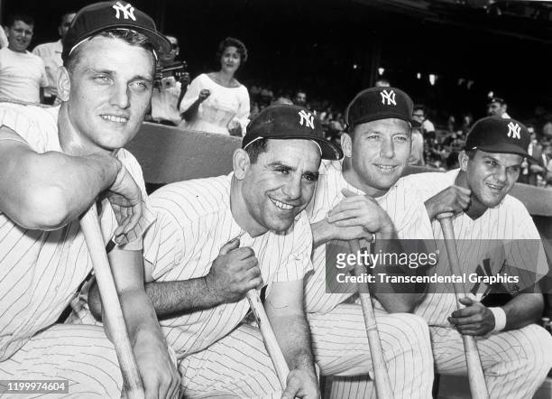 Portrait of four members of the New York Yankees as they pose in the dugout at Yankee Stadium, New York, New York, 1961. Pictured are, from left, are...