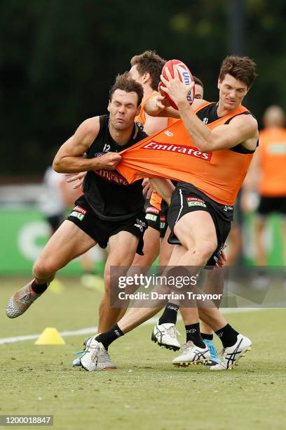 Matt Scharenberg tackles Brody Mihocek during a Collingwood training session on January 17, 2020 in Melbourne, Australia.