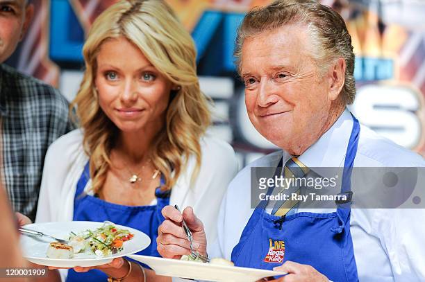 Personalities Kelly Ripa and Regis Philbin film a segment at the "Live With Regis And Kelly" taping at the ABC Lincoln Center Studios on July 28,...