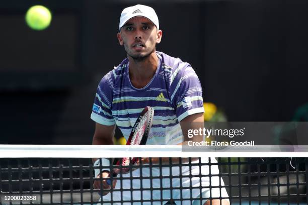 Ben McLachlan of Japan plays a forehand shot during the first set of his double match with Luke Bambridge of Great Britain against Sander Gille and...