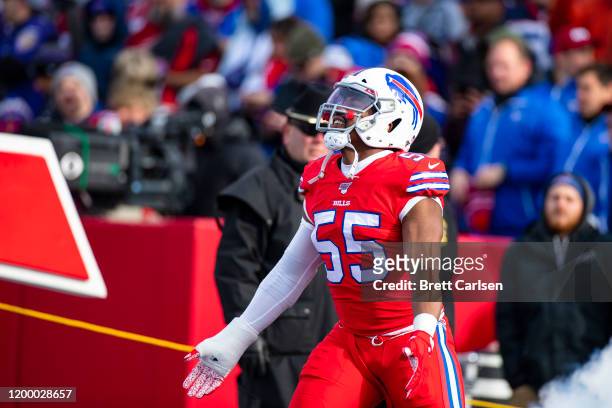Jerry Hughes of the Buffalo Bills runs onto the field before the game against the Baltimore Ravens at New Era Field on December 8, 2019 in Orchard...
