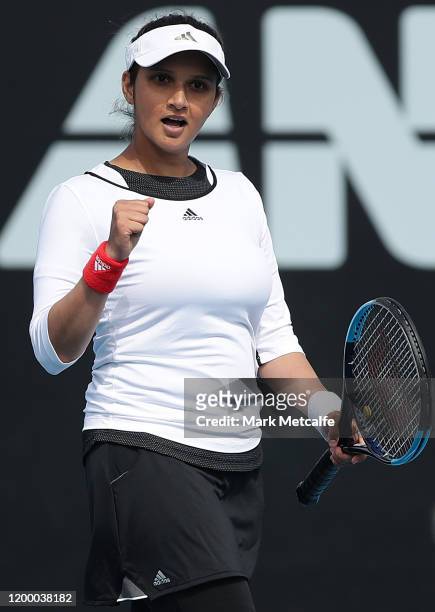 Sania Mirza of India celebrates winning match point during their semi final doubles match against Maria Bouzkova of Czech Republic and Tamara...