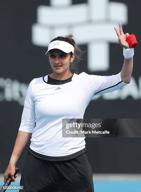 Sania Mirza of India celebrates winning a point during their semi final doubles match against Maria Bouzkova of Czech Republic and Tamara Zidansek of...