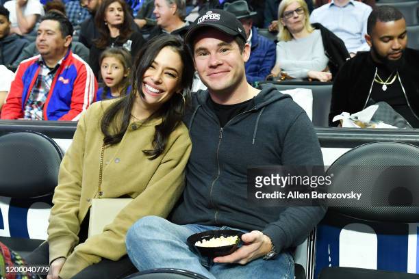 Adam DeVine and Chloe Bridges attend a basketball game between the Los Angeles Clippers and the Orlando Magic at Staples Center on January 16, 2020...