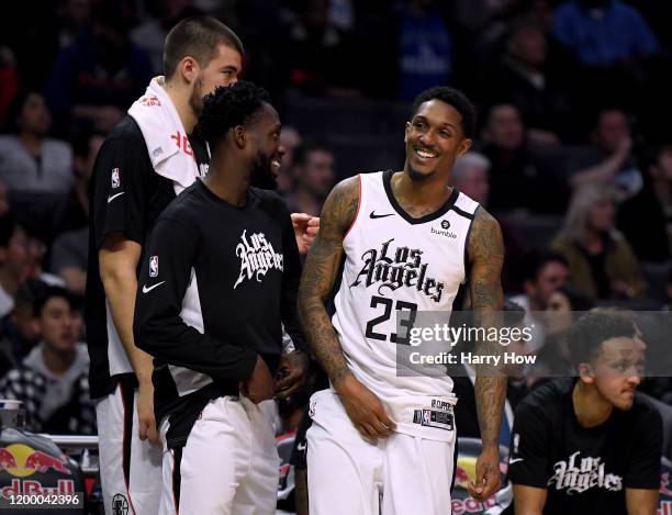 Lou Williams of the LA Clippers laughs with Patrick Beverley during a 122-95 Clipper win over the Orlando Magic at Staples Center on January 16, 2020...