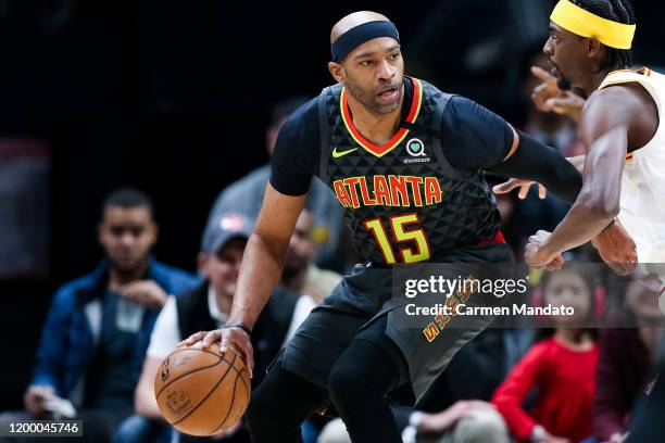 Vince Carter of the Atlanta Hawks controls the ball during the first quarter of a game against Justin Holiday of the Indiana Pacers at State Farm...