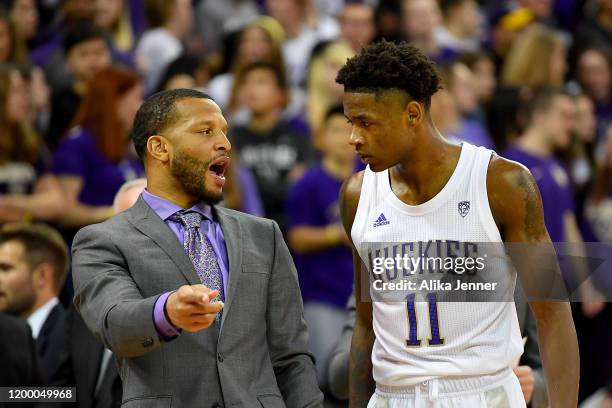 Nahziah Carter of the Washington Huskies get instruction from assistant coach Will Conroy at the Hec Edmundson Pavilion on January 16, 2020 in...