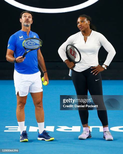 Serena Williams of United States speaks with coach Patrick Mouratoglou during practice ahead of the 2020 Australian Open at Melbourne Park on January...