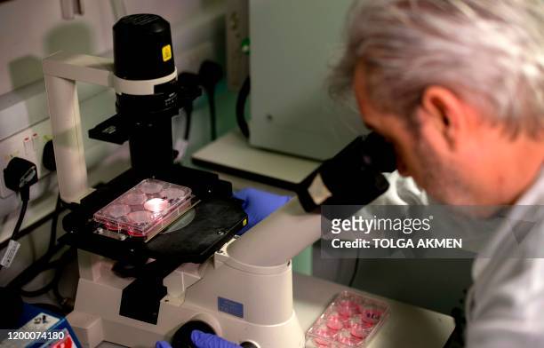 Doctor Paul McKay, who is working on an vaccine for the 2019-nCoV strain of the novel coronavirus, Covid-19,, poses for a photograph using a...