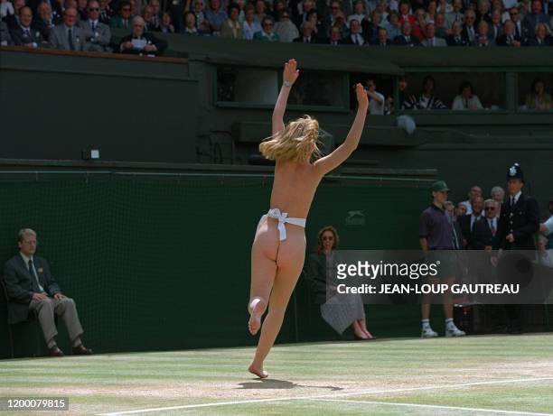 Streaker runs across center Court just before the Men's singles final opposing Dutch Richard Krajicek to American Malivai Washington at the Wimbledon...
