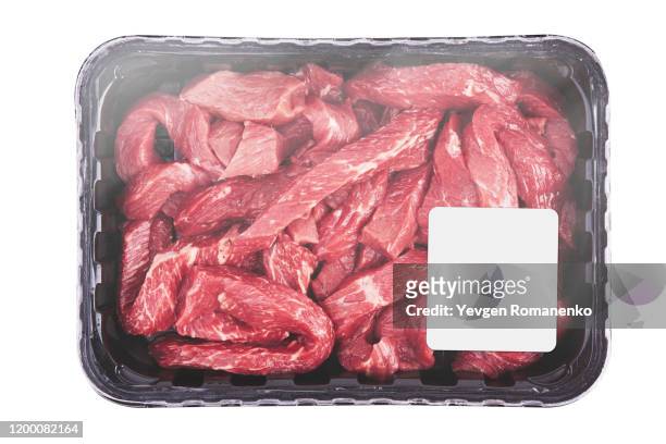 fresh raw meat in package with price tag, isolated on white background - meat packaging imagens e fotografias de stock