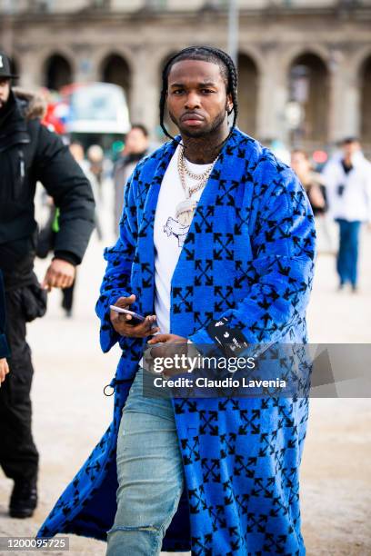 Rapper Pop Smoke, wearing a blue Off-White coat, is seen outside the Off-White show during the Paris Fashion Week - Menswear F/W 2020-2021 on January...